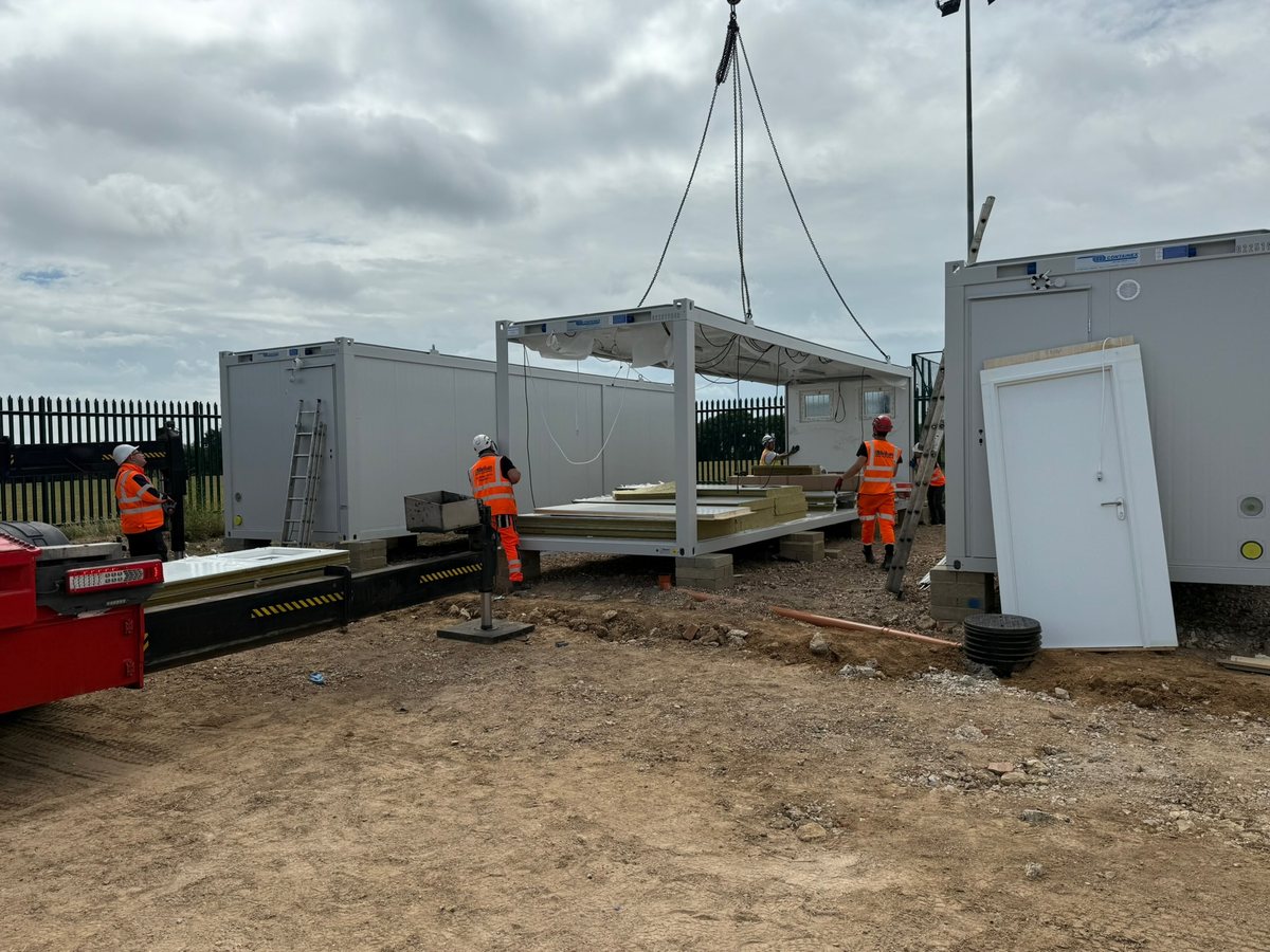 Cabinworx team installing a modular unit on site