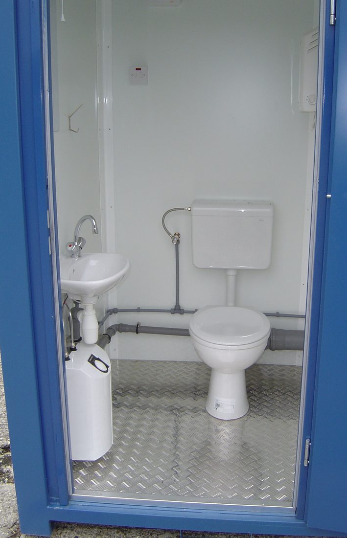 Interior of a 5ft single WC welfare cabin with toilet, basin and water heater