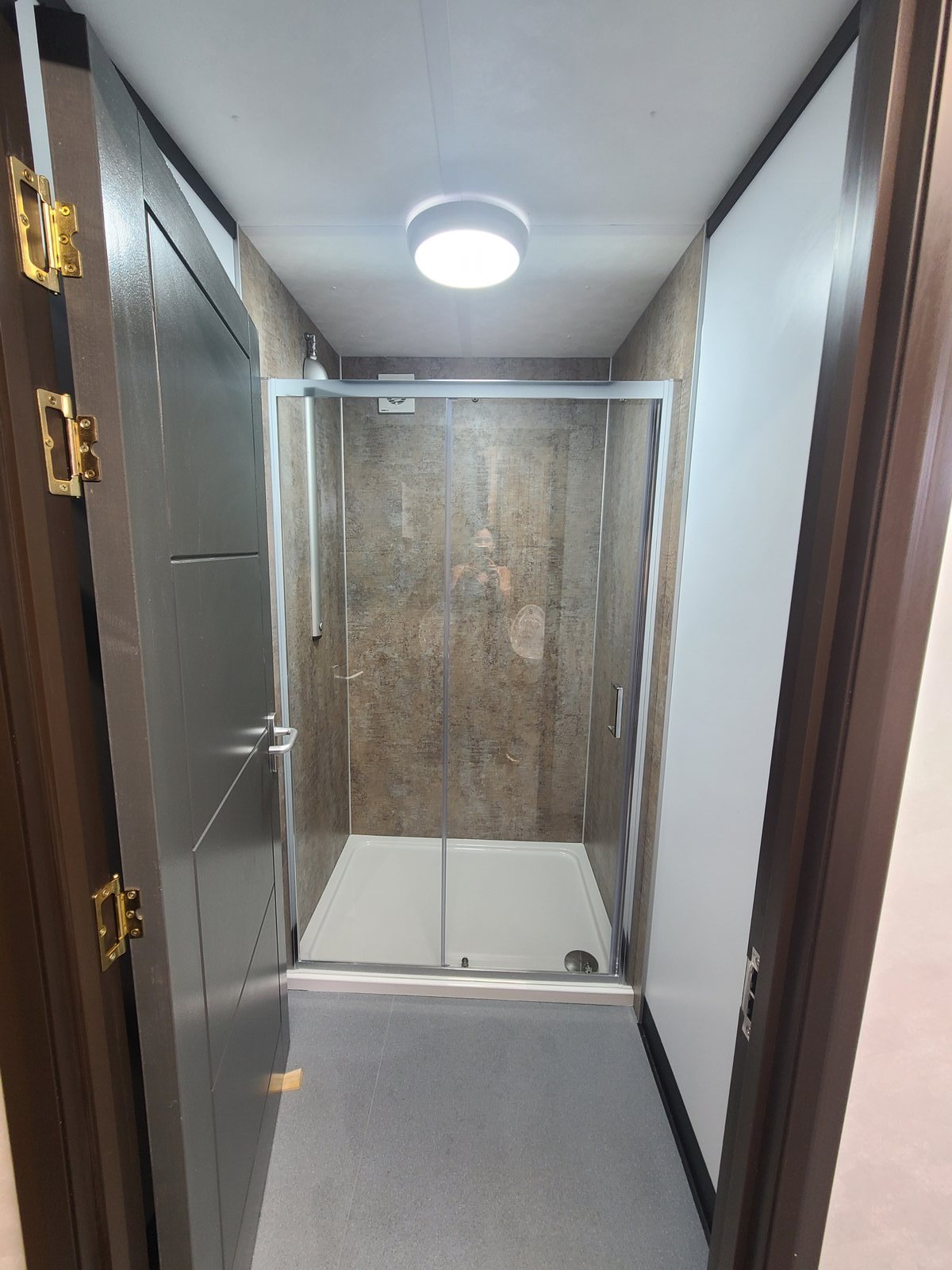 shower cubicle with glass sliding door inside a luxury shower block