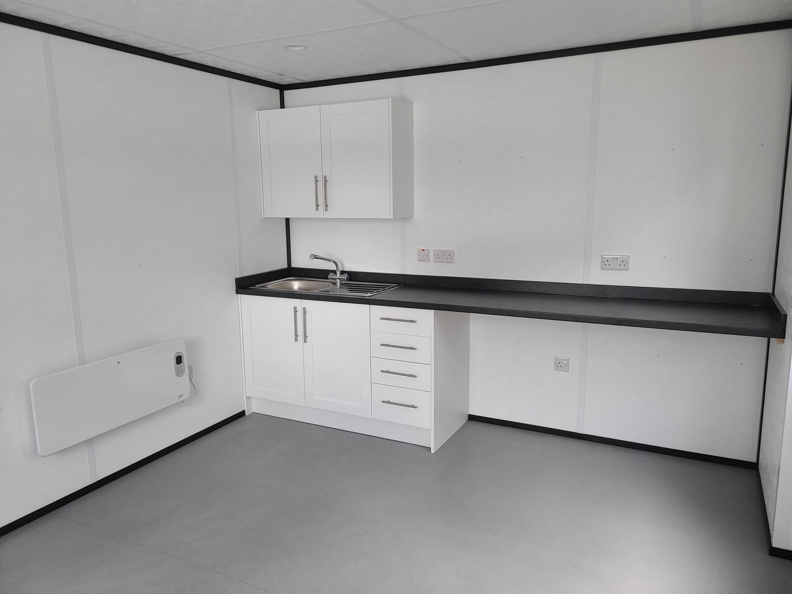 kitchenette run inside a modular welfare building