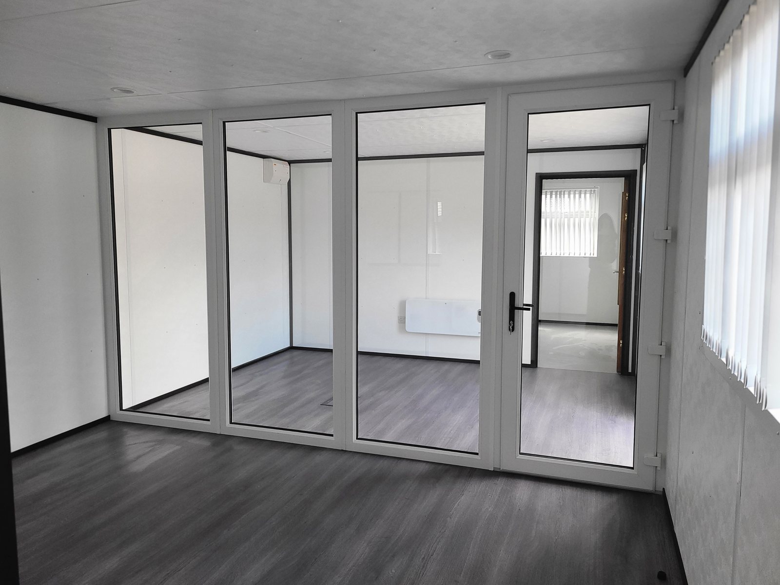 glazed partition rooms inside a modular staff building